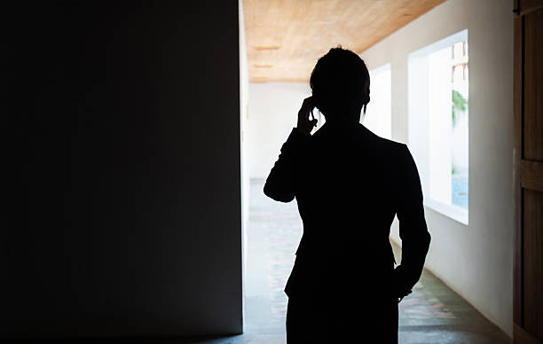 istock The silhouette of women using mobile phone 2240107161