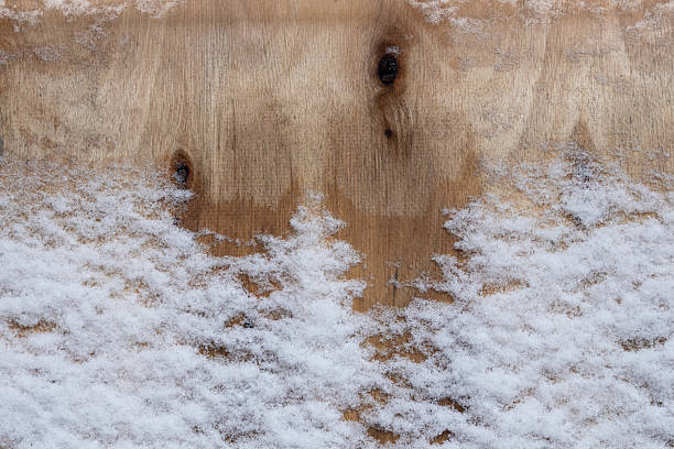 istock Wooden background covered with snow 2240109386