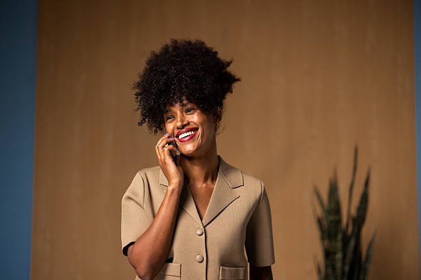 istock Happy black woman talking on mobile phone, smiling 2240109770