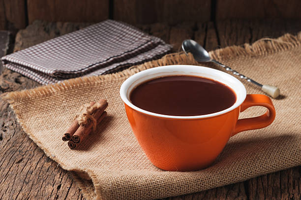 Hot Chocolate with Cinnamon on Rustic Wooden Table