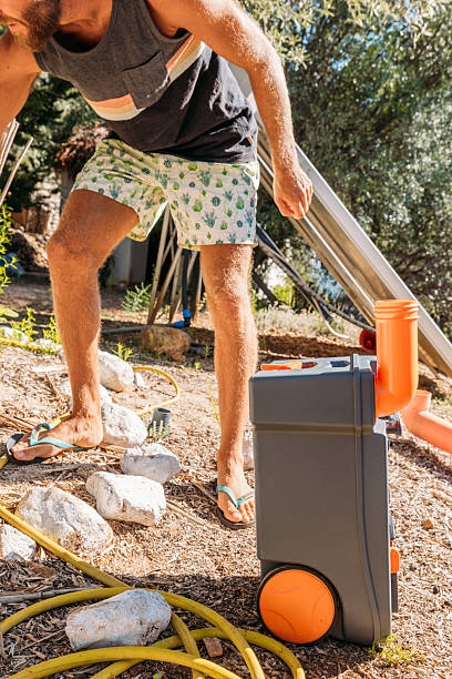 istock Man Using Portable Camping Toilet Outdoors 2240112616