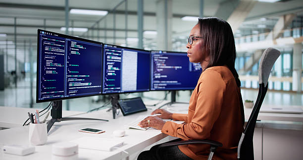 istock The African American Female Programmer Sitting 2240114051