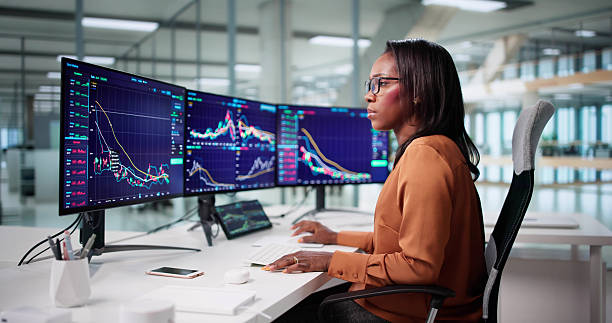 istock Female Stock Broker Analyzing Market Trends 2240114076