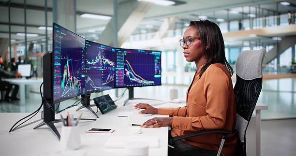 istock Successful Businesswoman Analyzing Stock Market Trends On Computer 2240114079
