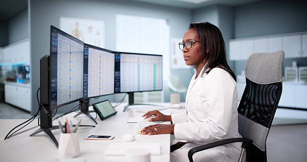 istock Diligent African American Doctor Manages Medical Billing Coding Audit Online 2240114123