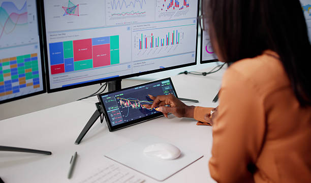 istock Young Executive Woman Analyzing Stock Market Data 2240114199