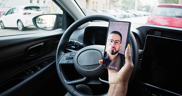istock African Woman Driving Car While Using Smartphone 2240114247