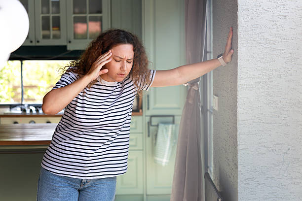 istock Young woman suffering from vertigo or dizziness problem of brain or inner ear 2240114265