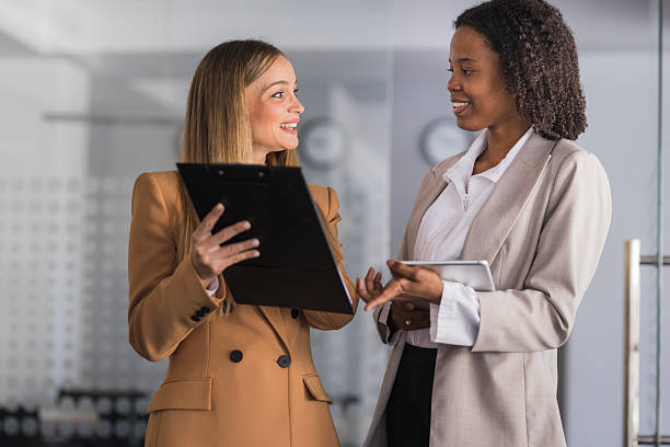 istock Professional businesswomen discussing project in modern office 2240114284