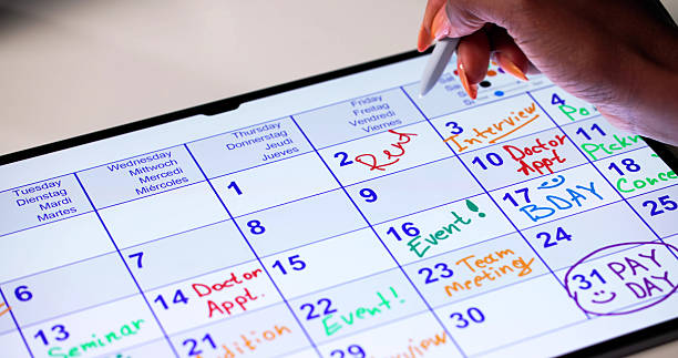 istock Woman Pays Rent On Time Using Digital Calendar 2240115225