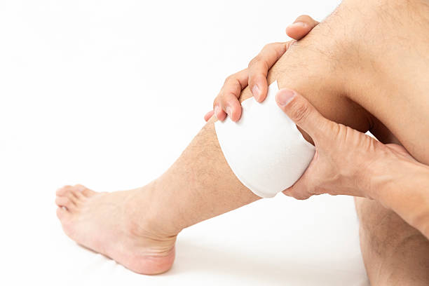 istock A man's leg with a compress on it, white background 2240116840