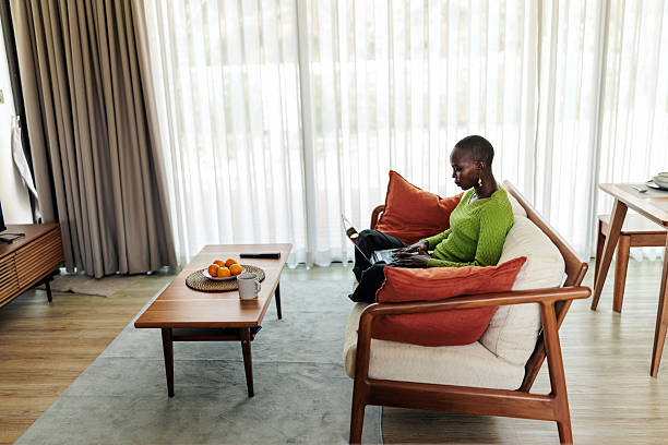 istock Black Woman Using Laptop at Home 2240118051