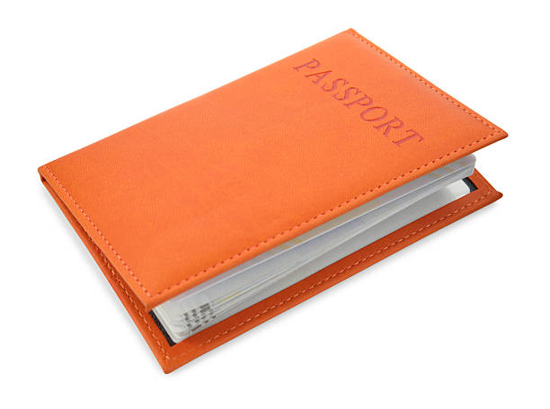 istock Passport in orange cover isolated on white 2240120827
