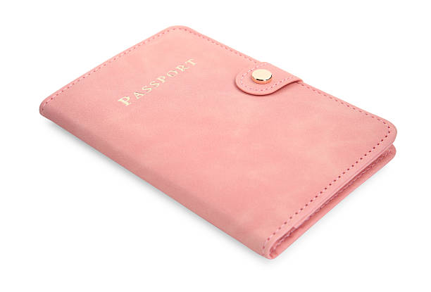 istock Passport in pink cover isolated on white 2240120863