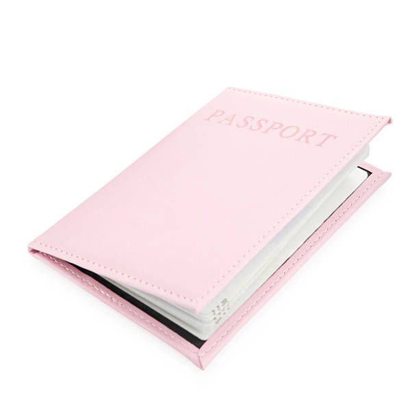istock Passport in light pink cover isolated on white 2240120868