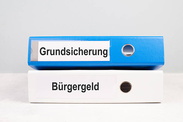 istock Citizen money, german language, becomes basic guarantee money security, new financial help reform for unemployment in Germany, social issue 2240121854