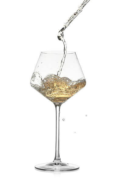 istock Tasty wine splashing in glass on white background 2240122084
