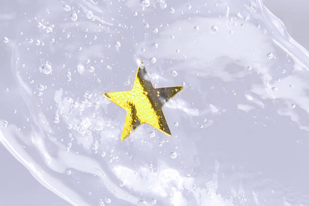 istock Cosmetic texture with gold star and air bubbles, copy space, real photo. 2240123409