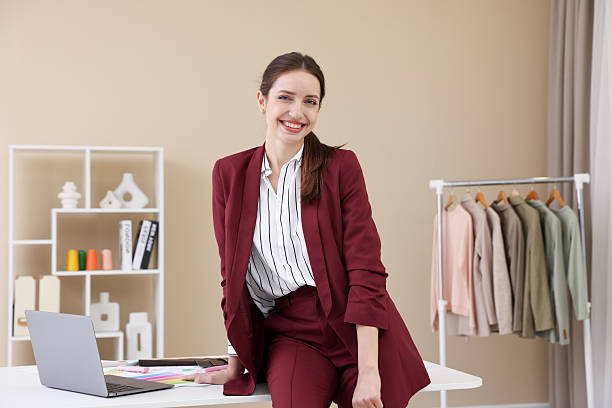 istock Fashion designer sitting on table in workshop 2240123493