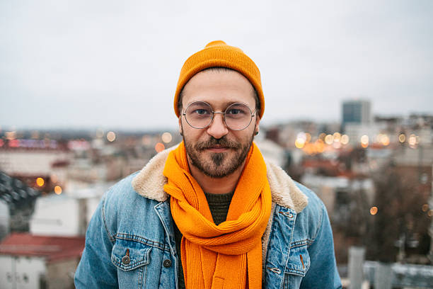 istock Confident Young Man in Casual Winter Outfit Standing on Rooftop 2240127997