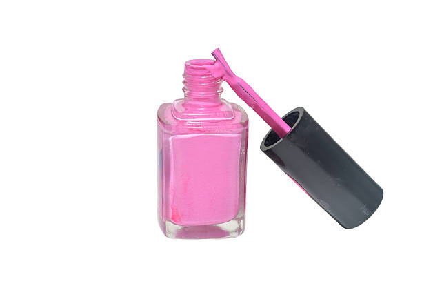 Square bottle with nail polish and brush isolated on white background.