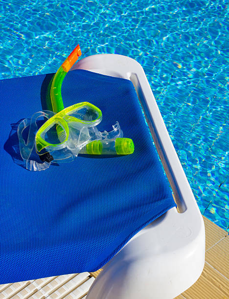 istock Mask and snorkel for diving near the pool 2240128842