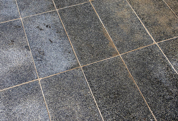 istock Granite floor tiles blue gray stone texture with a diagonal grout grid 2240130599