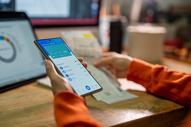 istock Person managing online banking and bill payments using smartphone 2240132184