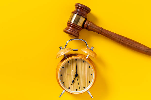 istock Alarm clock judges gavel, top view. Deadline and time management concept 2240132479