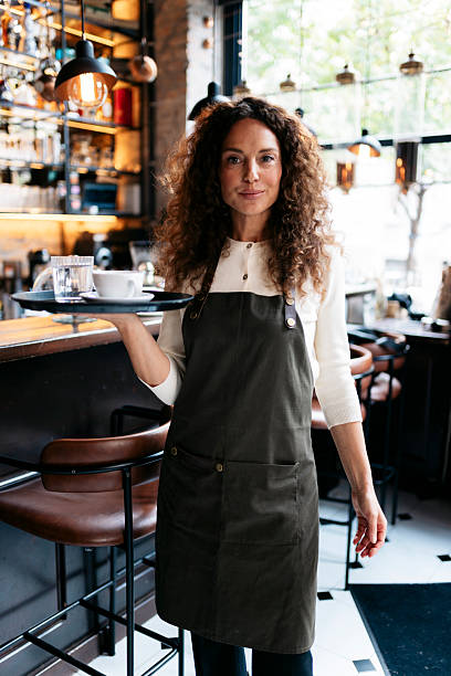 istock Barista serving coffee and water in cafe 2240133996