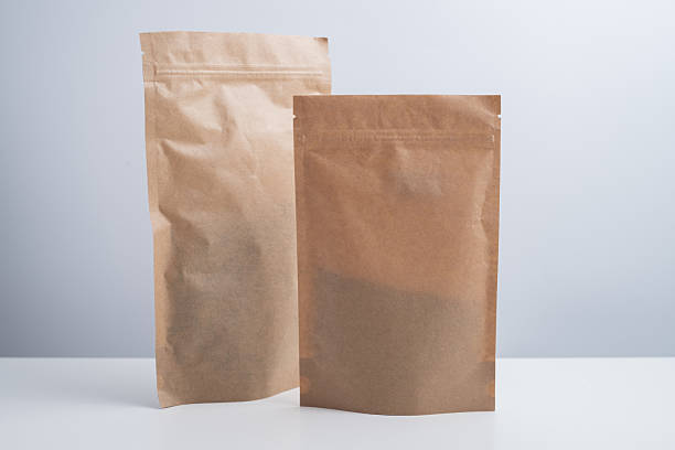 istock Craft packaging for tea, coffee, snacks, and cosmetics on a light background. Branding and product packaging mockup. Close-up of the packaging. Product for sale. Blank mockup. 2240134831