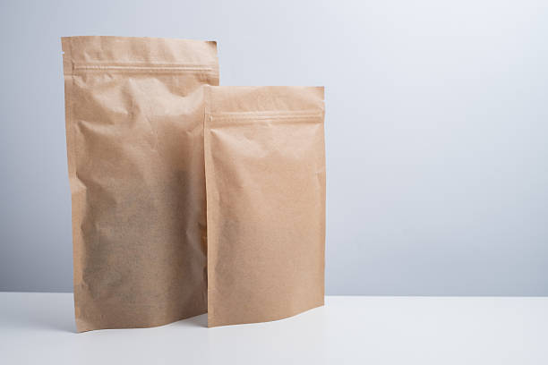 istock Craft packaging for tea, coffee, snacks, and cosmetics on a light background. Branding and product packaging mockup. Close-up of the packaging. Product for sale. Blank mockup. 2240134835