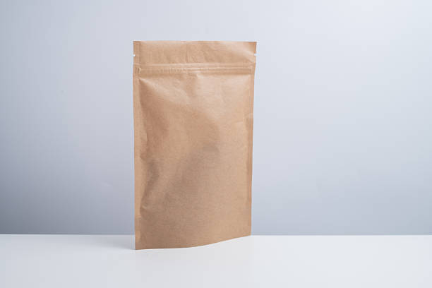 istock Craft packaging for tea, coffee, snacks, and cosmetics on a light background. Branding and product packaging mockup. Close-up of the packaging. Product for sale. Blank mockup. 2240134837