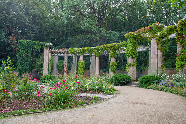 istock Colonnade and flowerbeds in Tiergarten 2240136227