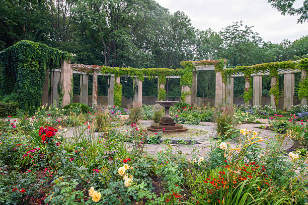 istock Colonnade and flowerbeds in Tiergarten 2240136241