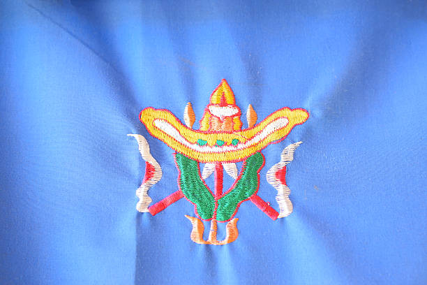 istock Embroidered Buddhist symbol, five in one symbol composed of five elements - a conch shell, a parasol, a victory banner, a dharma wheel and a lotus. Rinchen Chholing Monastery, Sikkim. 2240136275