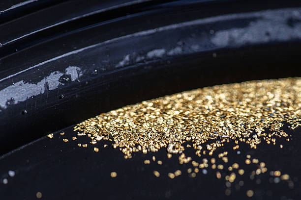 istock Gold Flakes in Black Pan 2240136922