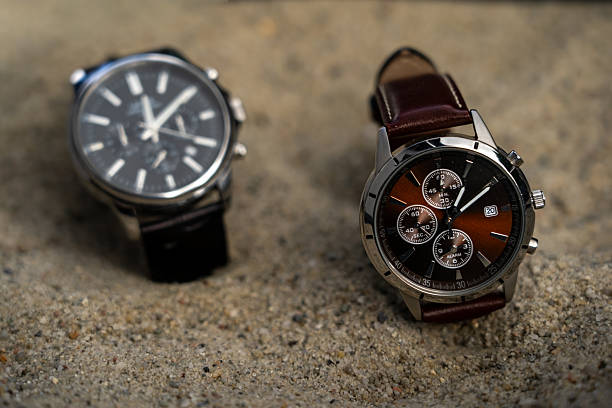 istock Daylight Saving Time (clock): Two stylish business watches with different time settings to represent the time change. It's not long until the summer/winter time change will happen 2240137504