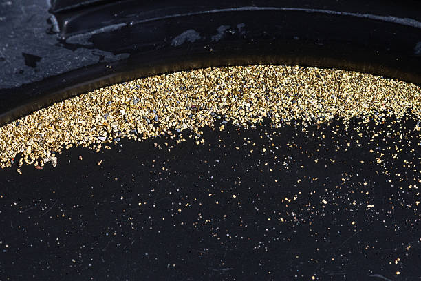 istock Gold Flakes in Black Pan 2240137777