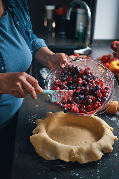 istock Preparing Berry Pie in Domestic Kitchen 2240140788