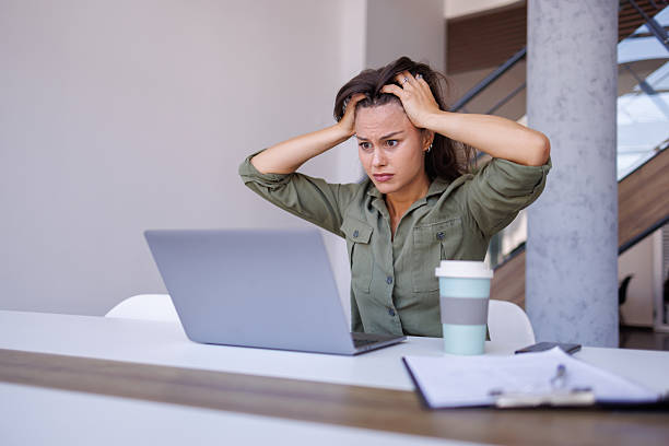 istock Woman experiencing stress and anxiety working on laptop 2240141130