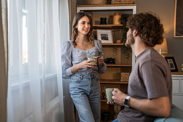 istock Couple interacting at home having morning coffee 2240142075