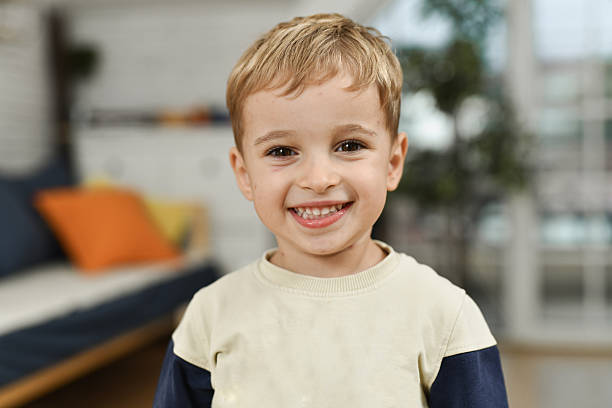 istock Smiling Young Boy With Chickenpox In A Cozy Indoor Home Setting With Warm Natural Light 2240144319