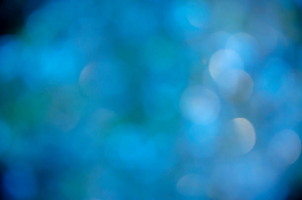 Blue glow. Abstract background. Light and bokeh. Abstraction circles on a black background.
