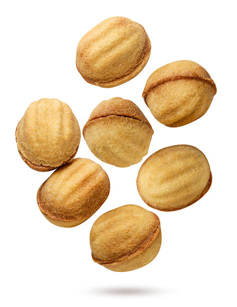 istock Nut shaped cookies flying on a white background. Isolated 2240152572