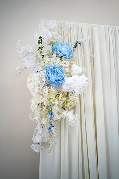 istock The wedding background is decorated with white and blue flowers. 2240160954