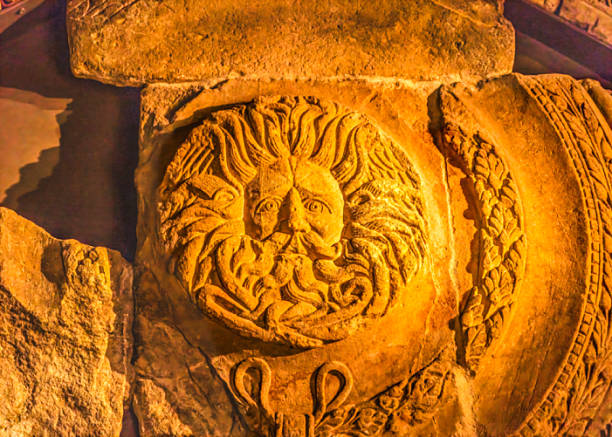 Weathered figure of an angel made of sandstone on the facade of a historic building in the old town of Dresden