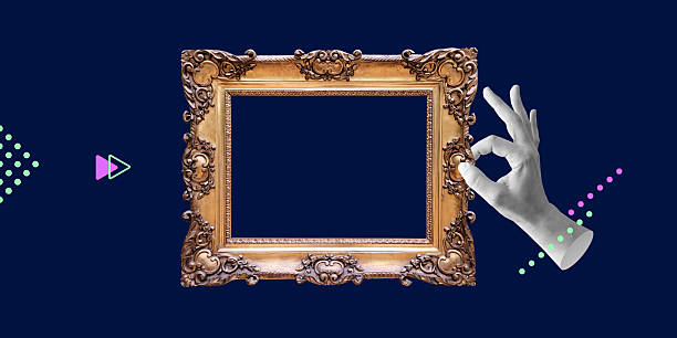 istock Hand holding ornate antique gilded frame on dark blue geometric background. Concept of creativity, presentation, or art exhibit. Copy space. Minimalist art collage 2240165955