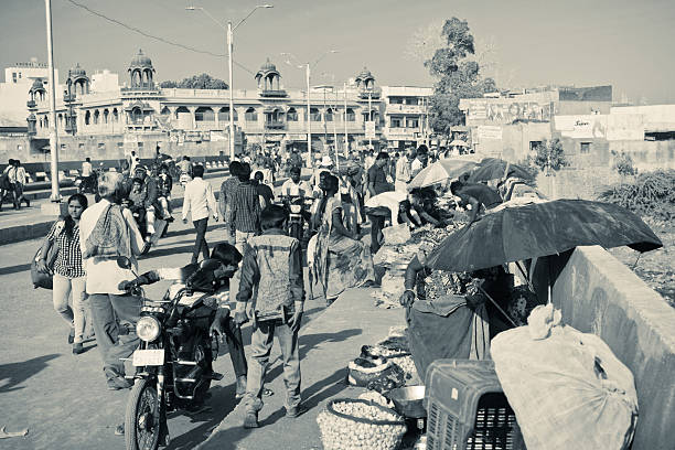 Palitana, Gujarat, India - January 13, 2016: local vendors sell goods on the small street market on the bridge across Kharo river in the heart of the town