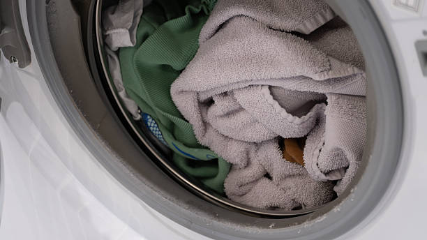 istock Still life view of laundry inside washing machine drum 2240167941